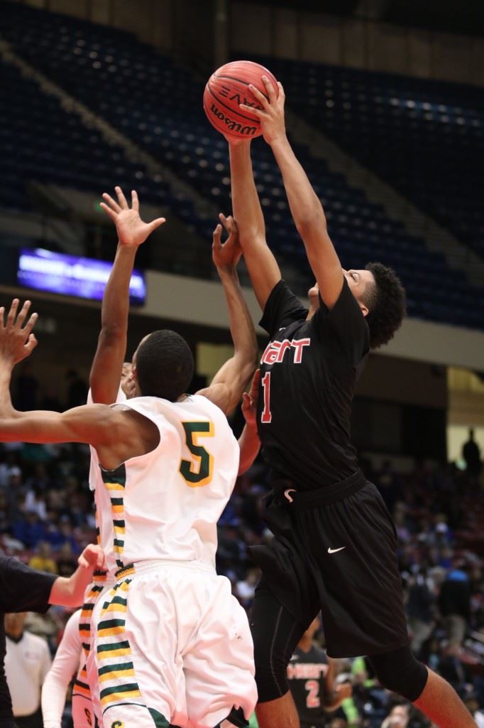 Diante Wood goes over Sunshine's Walter Jones (5) for one of his 15 rebounds.