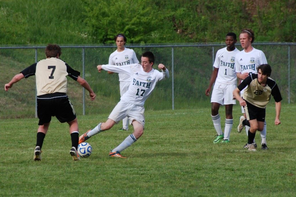 Faith Christian's George Clark (17) denies an Altamont challenge. On the cover, Lions keeper Caleb McCord makes another save. (Photos by Tony Bedford)