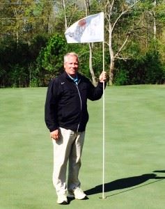 Cider Ridge assistant superintendent John Grubbs resets the flag on the fourth green. Grubbs spent nearly 20 years working at Augusta National. 