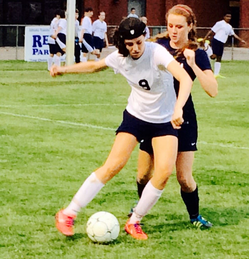 Jacksonville's Elizabeth Poe tries to protect the ball against Oneonta's Eliyah Knight. Poe scored two goals for the Lady Golden Eagles.