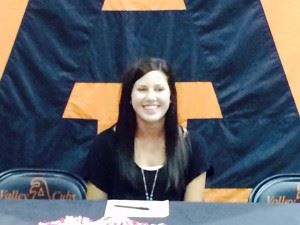 Alexandria senior golfer Jordan Gregoria is all smiles after signing with Jacksonville State. On the cover, baseball players Derrik Turner (L) and Justin Whitley sport the caps of the college teams they'll be playing for next season.