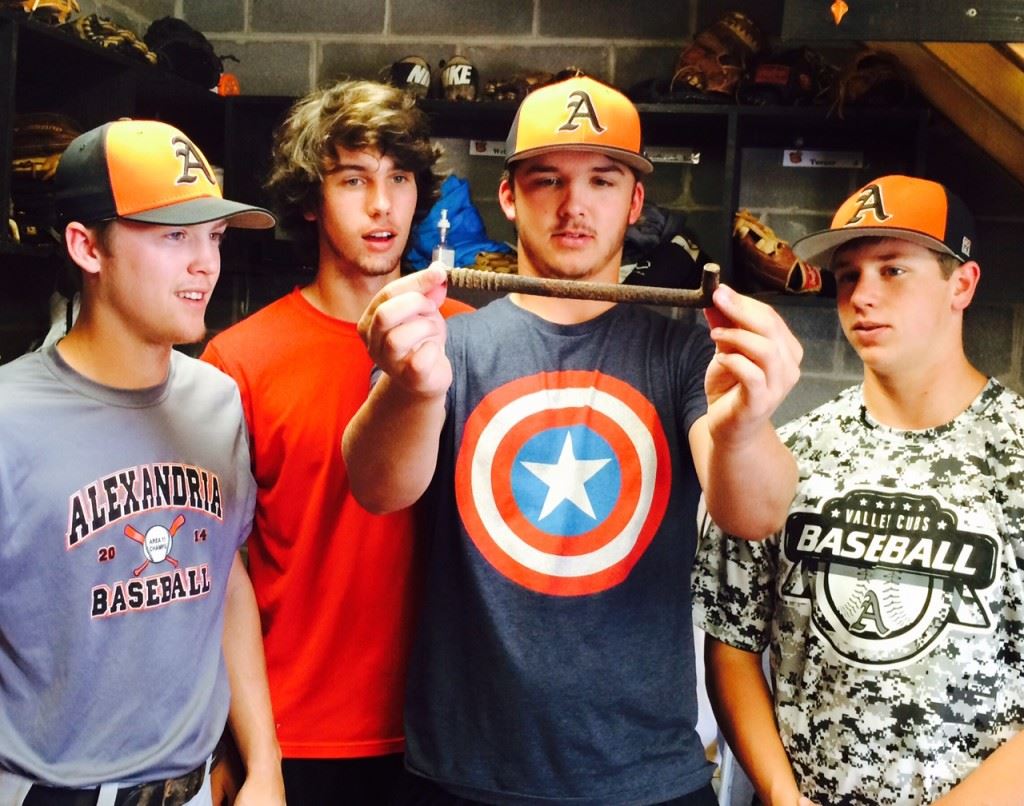 Alexandria players (from left) Chance Williams, Will Reaves, Alex Campbell and Cayden Marsh admire the spike (below) that has been the Valley Cubs' good-luck charm.