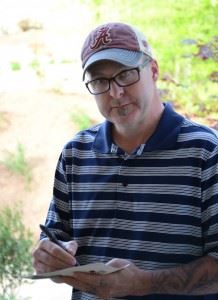 Ted Saylor rechecks his scorecard after Sunday's round in the Cider Ridge Invitational. (Photo by B.J. Franklin)