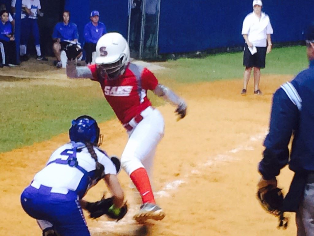 White Plains catcher Carley Wood prepares to put the tag on Saks' Daja Johnson for the final out of their game Monday night.