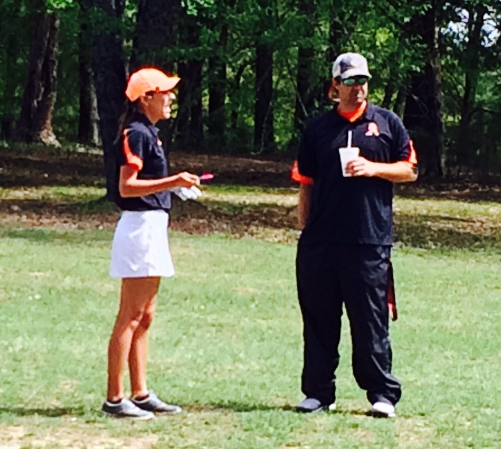 Alexandria's Katie Roberts (L) gets some advice from Cubs coach Scott Ginn during the girls County Championship earlier this season.