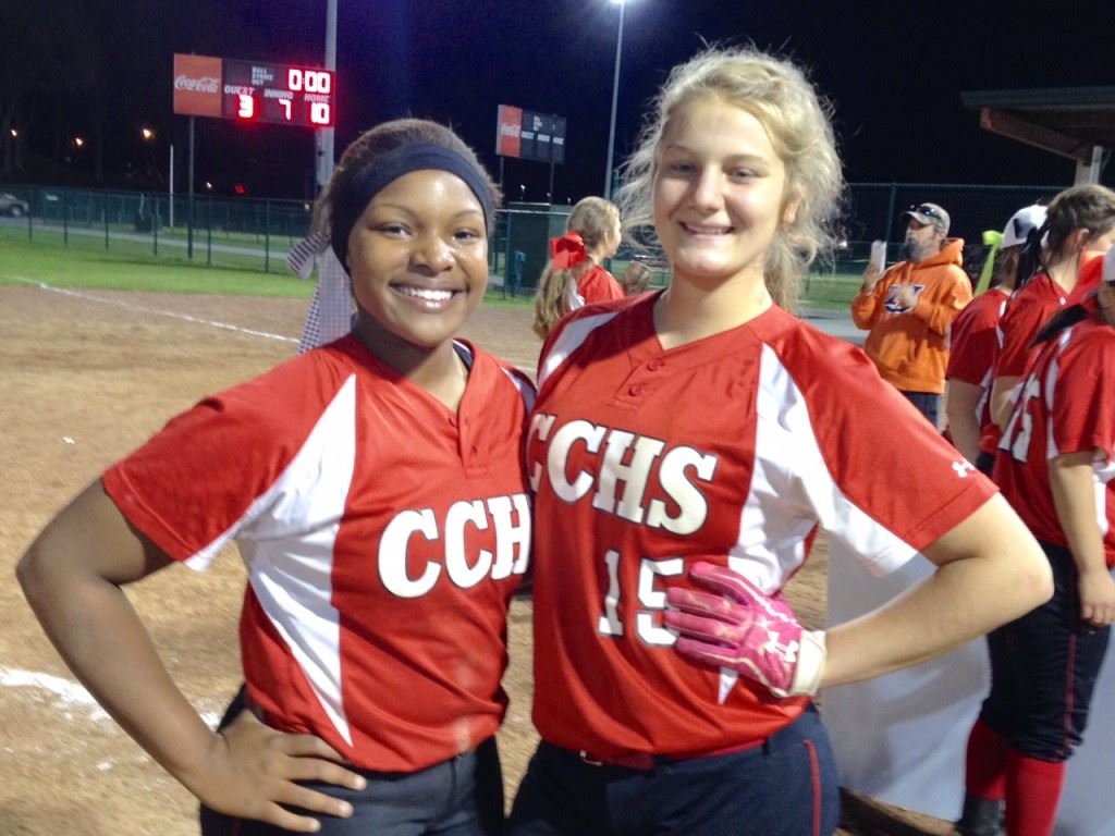 Cleburne County's Kiara Akles (L) won three games in the circle and had three hits in the championship game, while Chelsea Parker had three hits in the finals and the game-winning hit in the semis. On the cover, the Tigers celebrate victory. 