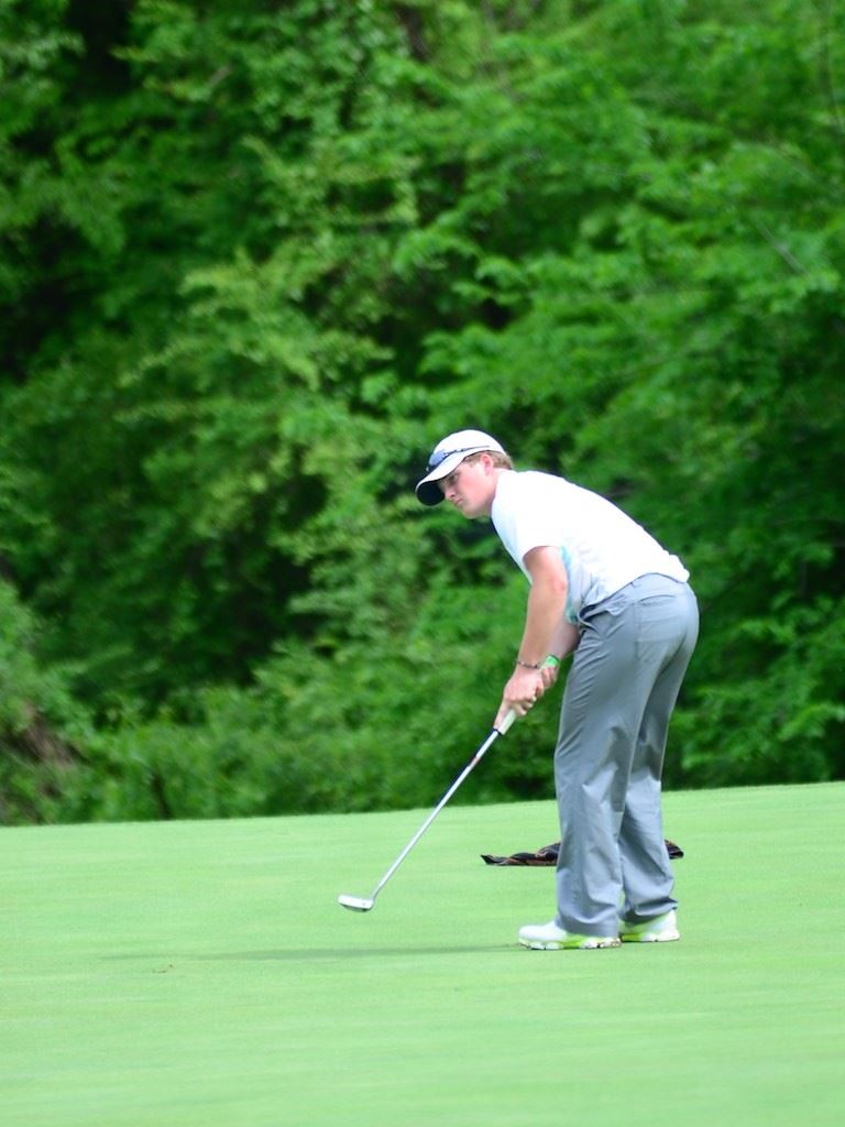 Chase Larkin watches his putt roll towards the cup during Saturday's first round of the Cider Ridge Invitational. (Photo by B.J. Franklin)