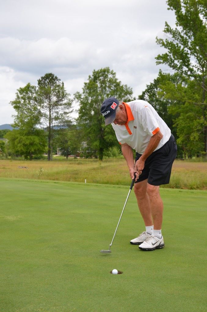 David Martin follows a putt into the hole during the Cider Ridge Senior Scramble Tuesday. Martin and partner Norris Ray won the tournament. (Photo by B.J. Franklin)