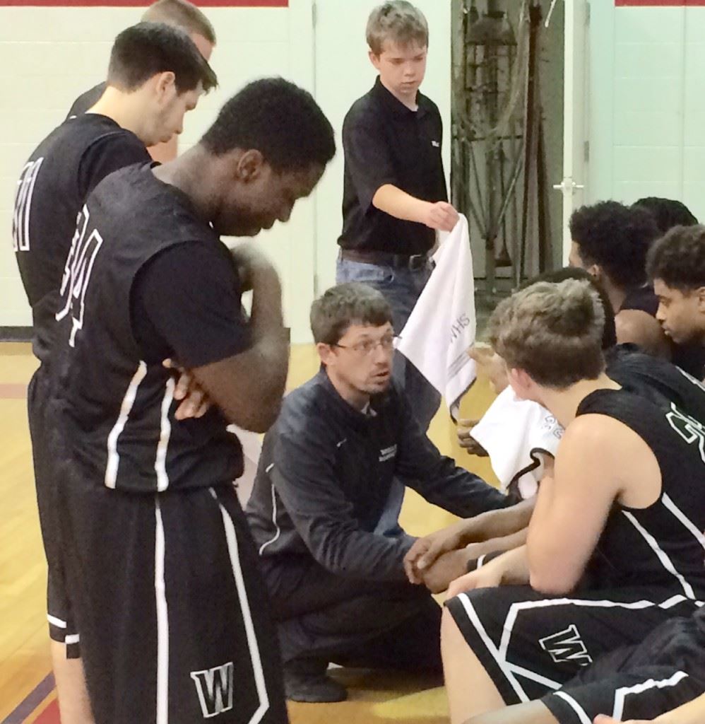 Beau Winn (C) gives his Wellborn basketball team instructions during a time out in a game at Ohatchee this past basketball season.