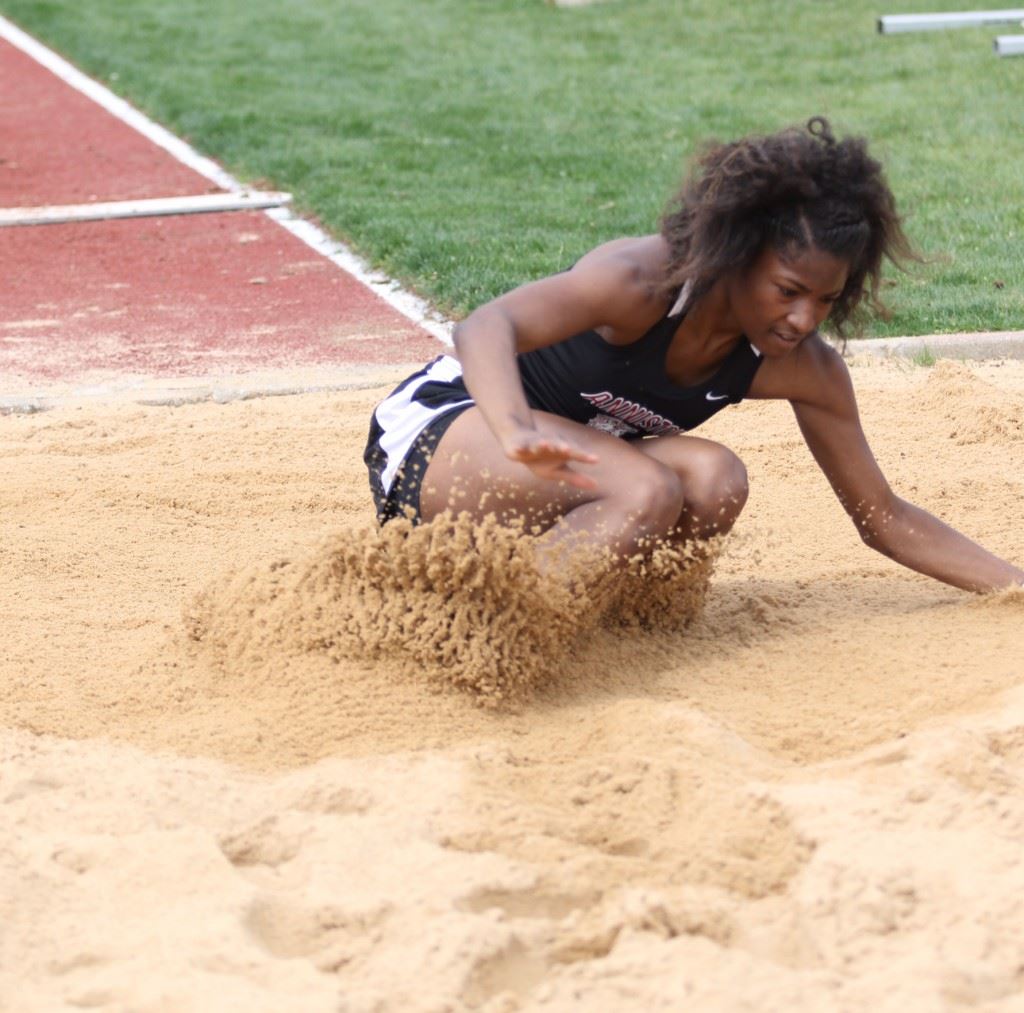 Anniston's Carsheuna Curry lands in the pit after a long jump at the Calhoun County Meet earlier this year. Curry won the 5A state title Wednesday. (Photo by Kristen Stringer/Krisp Pics Photography)