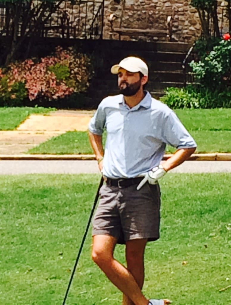 Jackson King waits his turn to tee off on the 17th hole at Anniston CC Thursday. On the cover, Freeman Fite (R) follows his drive off the 17th tee.