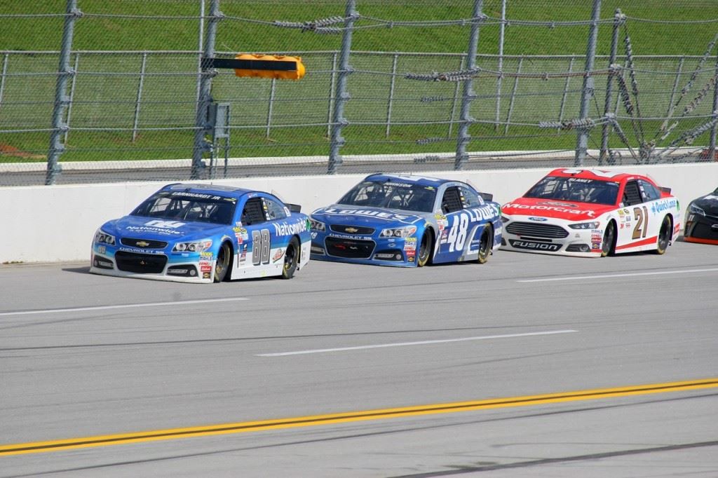 Dale Earnhardt Jr. (88) leads Jimmie Johnson (48) and Ryan Blaney late in the Geico 500.