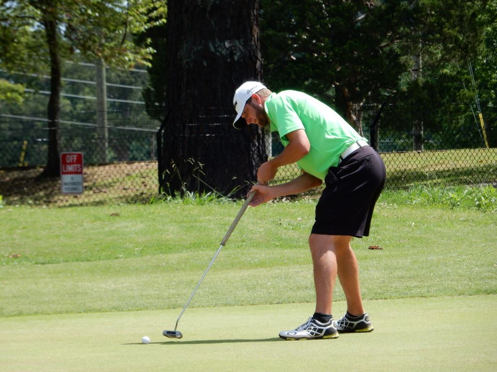 First-round co-leader Kyle Sapp drops an eagle putt on the fifth green Friday. Sapp doesn't anchor his long putter, so he has no issue with that impending ban, but he said if the USGA ever made a rule regarding putter lengths, he'd cry foul as "discrimination toward tall people."