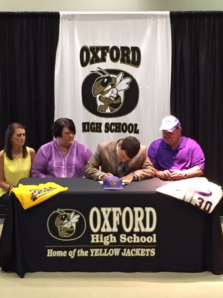 Oxford right-hander Mason Wilkins makes it official, signing his letters to play baseball at Miles College Wednesday. (Photo courtesy Oxford HS).