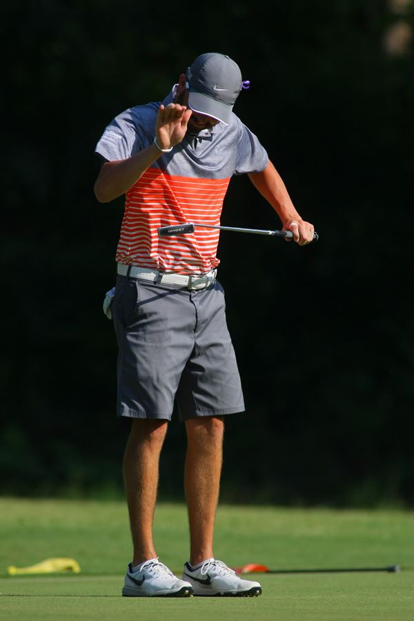 Brennan Clay gives his putter a frustrated rap after missing a putt on the 11th hole Sunday that was the turning point to he and Jeremy McGatha's fortunes in the Sunny King Charity Classic. (Photo by Greg McWilliams).