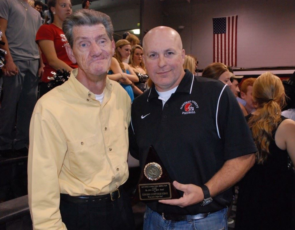 Cleburne County coach Mark Hilburn (R) shares a moment with Mike Pruitt after winning last year's Coaches Challenge during the East Central Alabama UCP Telethon. 