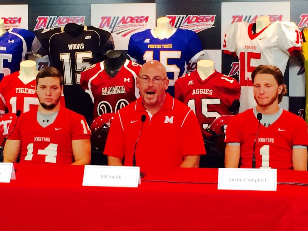 Mumford coach Bill Smith (C) talks about his first season with the Lions, flanked by linebacker Austin Stephens (L) and versatile Austin Campbell.