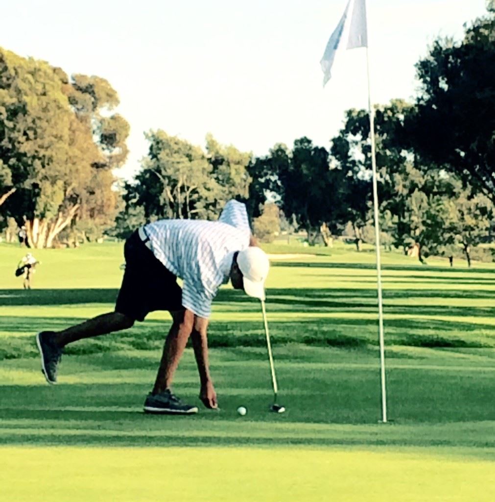 Jacob Lecroy returns his ball to its spot before knocking in a three-foot birdie putt on No. 6 at Torrey Pines Thursday. (Photo by Lewis Lecroy)