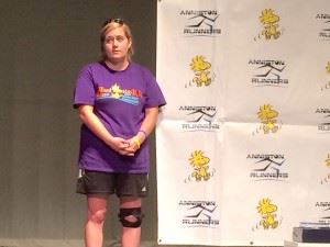 Race director Haley Gregg gets ready to address the runners during the awards ceremony of last year's Woodstock 5K.