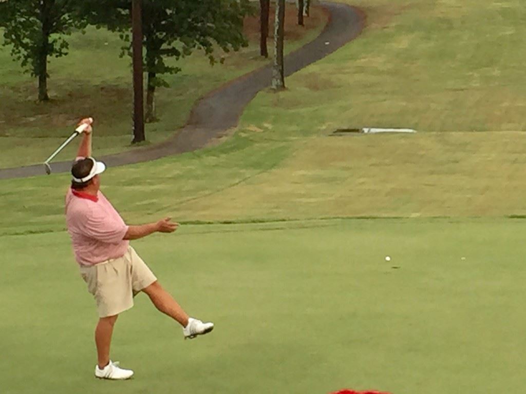 Chad Calvert reacts to just missing a putt in Sunday's final round of the Dub Ellis Invitational. On the cover, Calvert (L) is congratulated by Cherokee County CC GM Steve Baker after winning the tournament. (Photos by Jake Minnix)