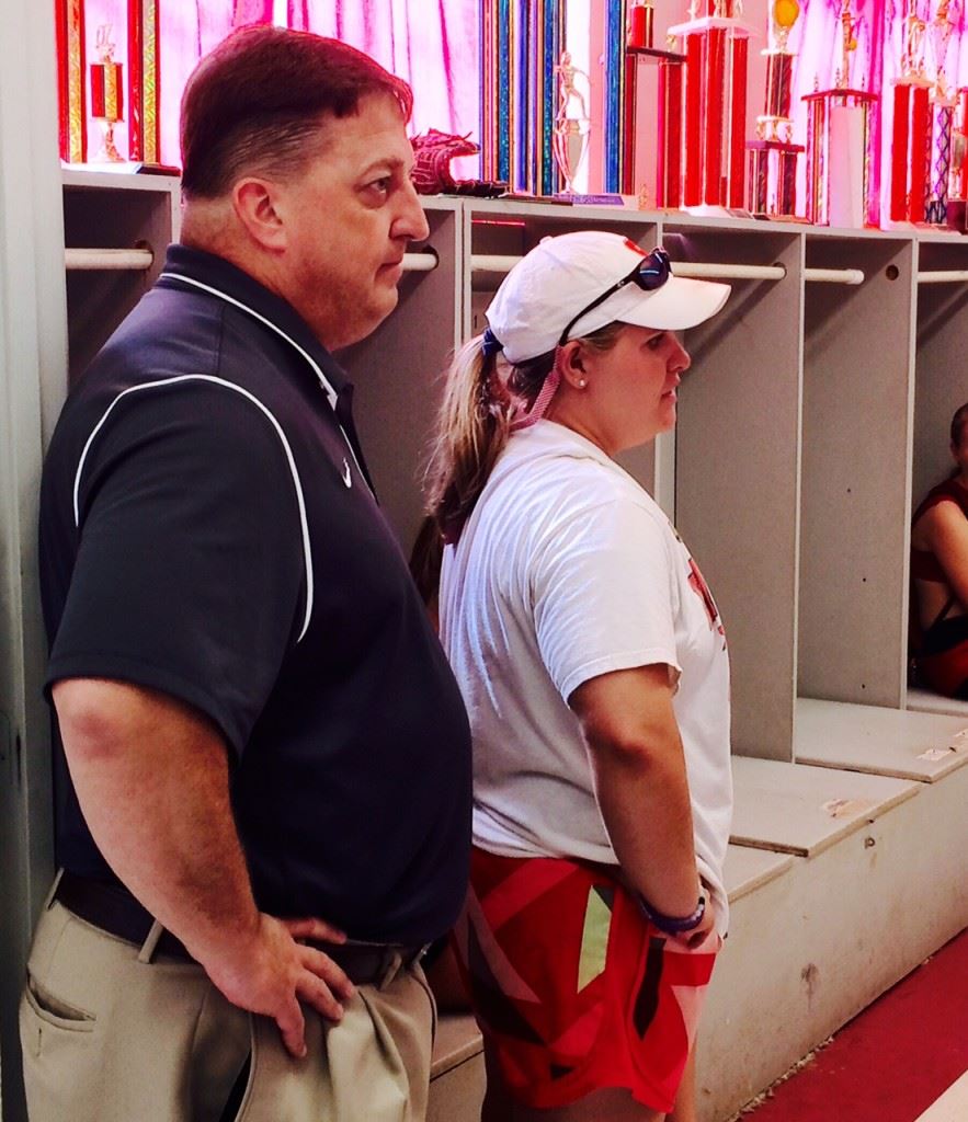 Cara Law (R) addresses her team after being introduced as Saks' new head softball coach by principal Jody Whaley.