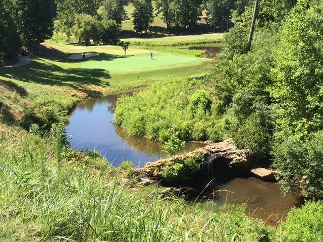 No. 12 is the signature hole at Cider Ridge. The par-3 is guarded by a creek spills over a dramatic waterfall when the water is running. (Photo by Al Muskewitz)