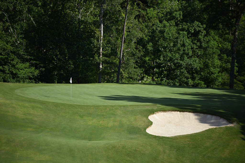 There's not much room behind the tenth green, although some players may elect to hit their shot off the hill on the left side in hopes of holding the putting surface. (Photo by Sandra Howell)