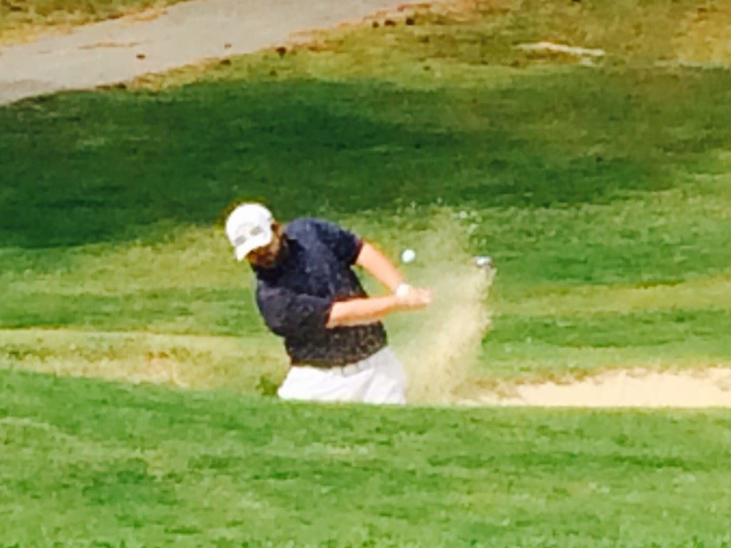 Caleb McKinney blasts out of a bunker on No. 6 during his match with Dalton Chandler Tuesday. McKinney won the hole to take a 2-up lead.