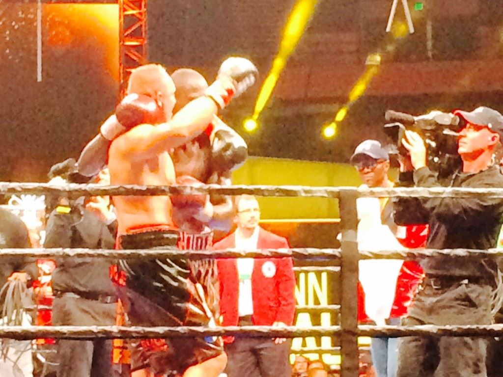 Deontay Wilder respectfully walks Johann Duhaupas (L) around the ring after Wilder won their hard-fought WBC heavyweight title fight Saturday night.