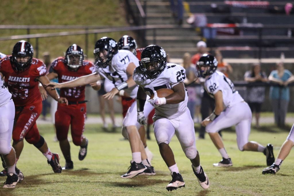 Wellborn's D.J. Rhoden turns the corner and heads up field during his big game against Weaver Friday night. BELOW: Rhoden finds the end zone for one of his six touchdowns. (Photos by Kristen Stringer/Krisp Pics Photography)