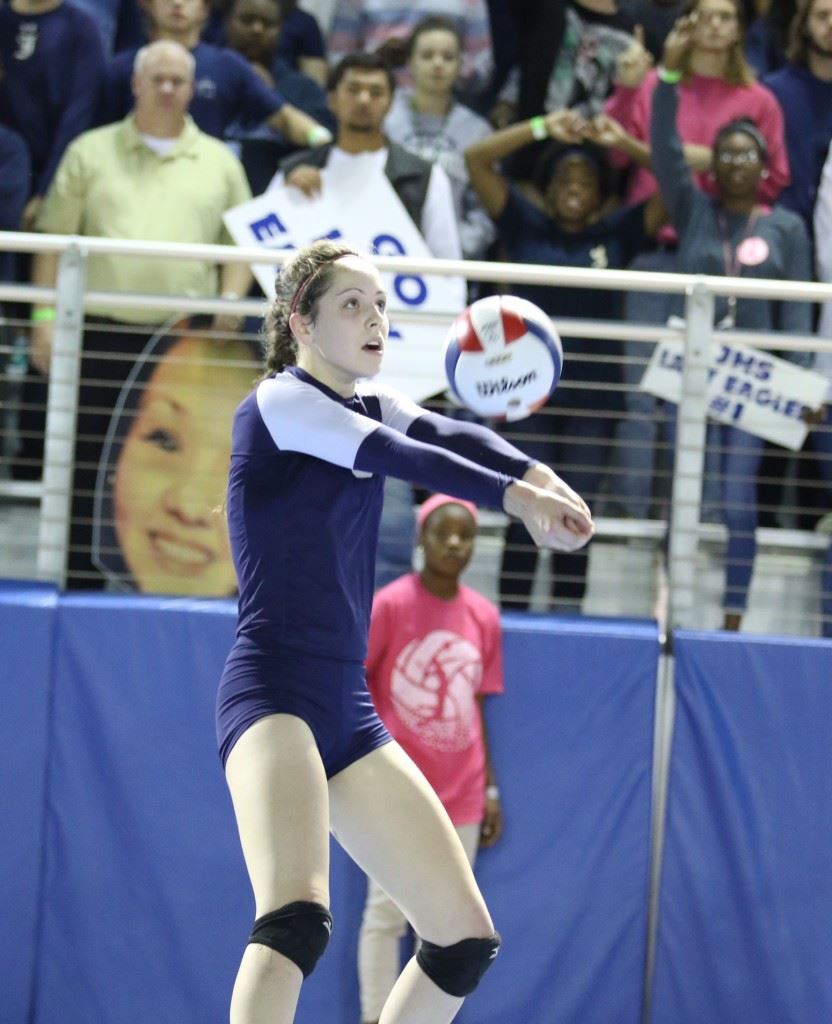 Jacksonville's Elizabeth Poe keeps a ball alive in the match against Brooks. On the cover, Sierra Stone smashes a point over the net. Below, Brandi Canady serves. (Photos by Kristen Stringer/Krisp Pics Photography)