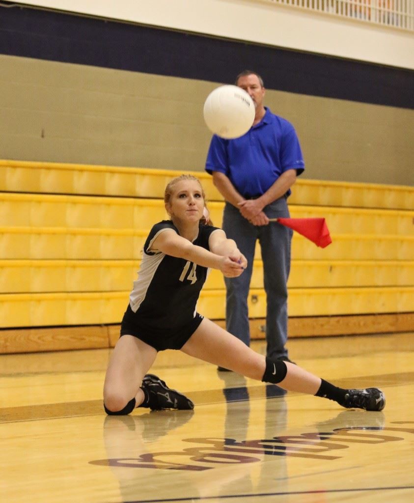 Taylor Ellison keeps the ball alive in Oxford's semifinal victory over Alexandria. (Photo by Kristen Stringer/Krisp Pics Photography)