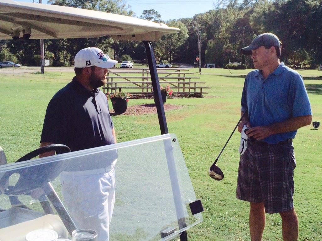 Caleb McKinney (L) and Kevin Daugherty go through the ground rules before embarking on their Calhoun County Match Play championship match Thursday.