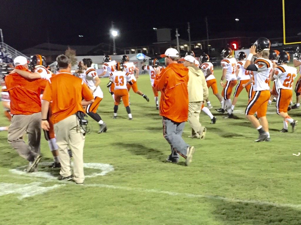 Alexandria's bench erupts onto the field after the Valley Cubs beat Moody to clinch their first region title since 2012.