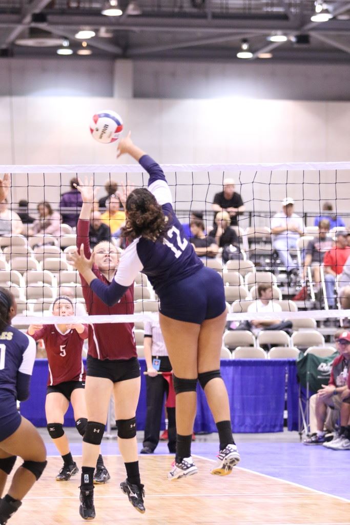 Jacksonville's Sierra Stone goes high to put away a shot against Deshler. (Photo by Kristen Stringer/Krisp Pics Photography)