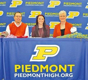 Torrie Roberts (center) and her family are all smiles after the Piedmont shortstop signed to play softball at Jacksonville State on Thursday. (Photo courtesy of Shannon Fagan)