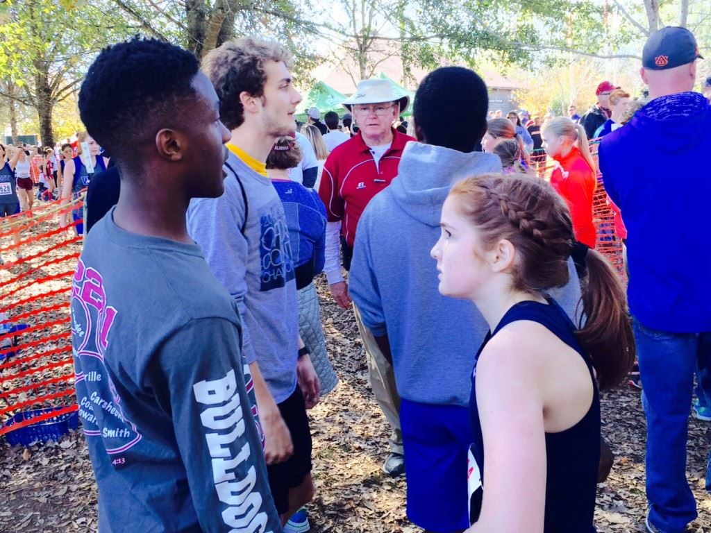 Calhoun County champions Zebedee Lunsford (L) and Rebecca Hearn talk about their respective races at Saturday's state cross country meet.