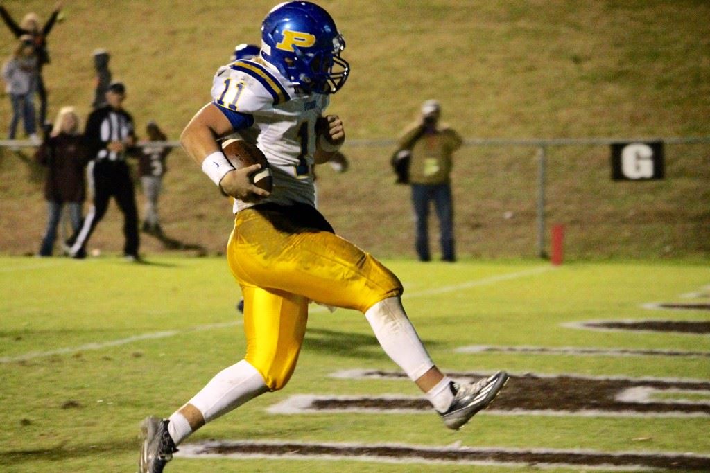 Piedmont quarterback Taylor Hayes scampers into the end zone for the first of his two rushing touchdowns Friday night. (Photo by Kirk Keener)