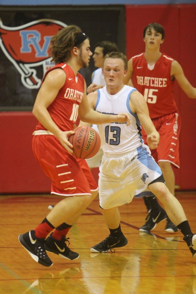 Pleasant Valley's Josh Faucett (13) steps in to impede the progress of Ohatchee's Micah Lee (10). The Raiders' second-half defense keyed their season-opening victory. (Photo by Krista Walker)