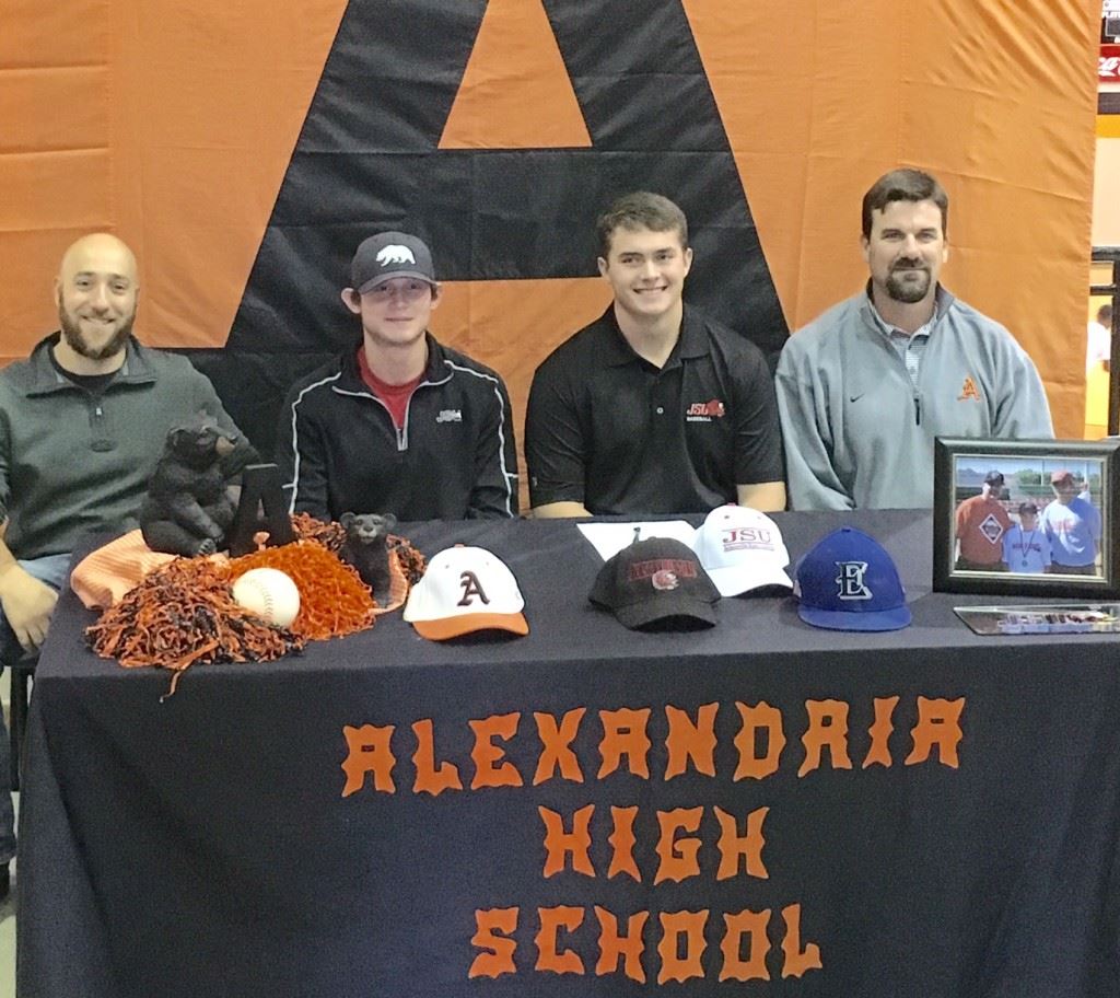 Alexandria pitcher Cody Dodd (third from left) sits with some of his baseball influences during his signing party Friday. From left, Excel Baseball co-founder Josh Beshears, former Alexandria and soon-to-be JSU teammate Dalton Cobb and Alexandria baseball coach Andy Shaw. On the cover, Dodd celebrates his signing with friends.