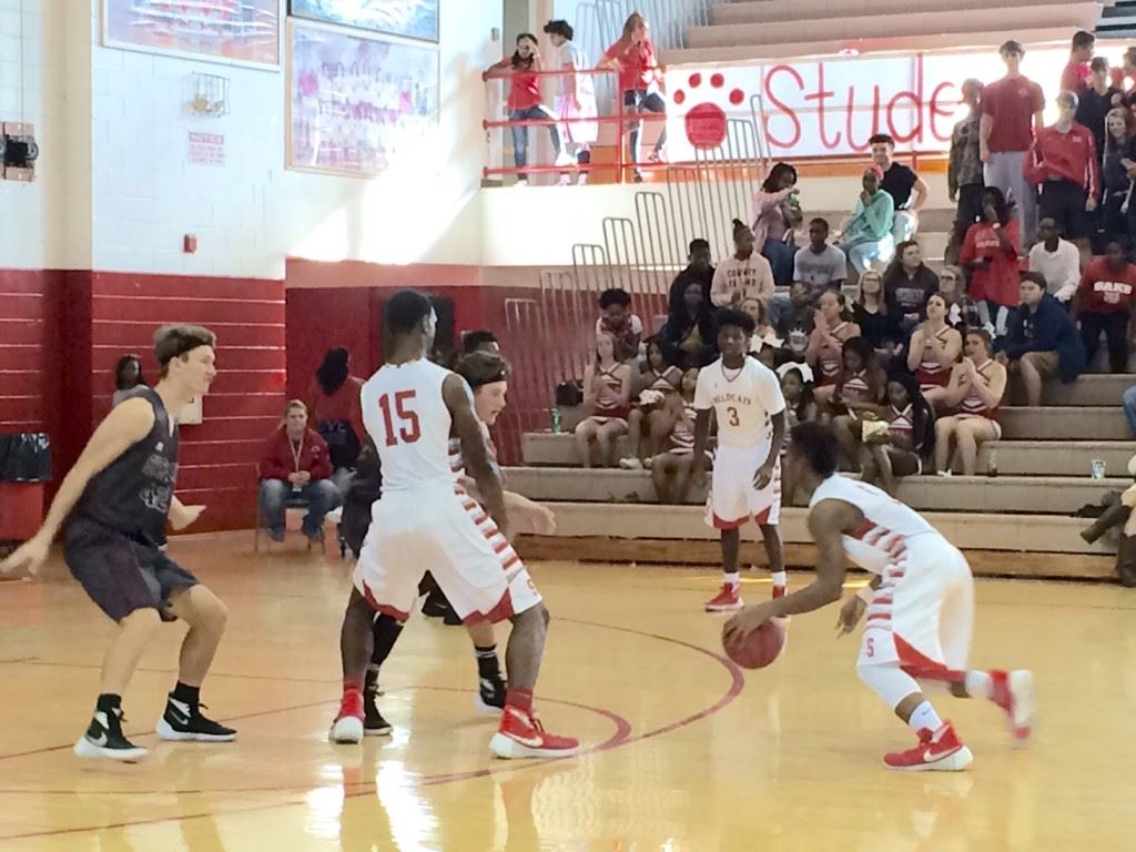 Saks' Jalen Britt drives to the basket in Friday's victory. He did most of his damage from the outside with six 3-pointers.