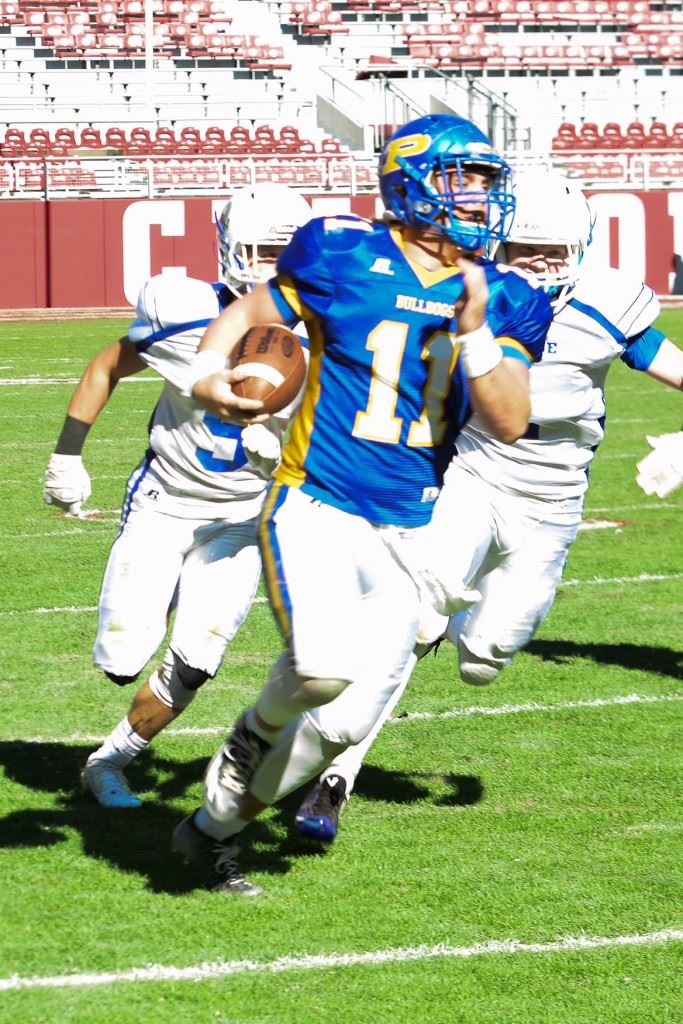 Piedmont quarterback Taylor Hayes leaves two Bayside Academy defenders in his wake as he streaks down the sideline on a 48-yard touchdown run in the second quarter. (Photo by Billy Garrett/garrettsportshots.com)