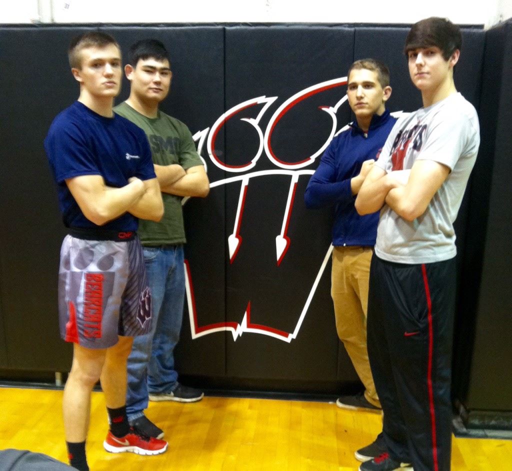 Weaver senior wrestlers (from left) Brannon Bellar, Chase Rodgers, Collin Allison and Tyler Johnson await the final home match of their careers. On the cover future Marines Bellar, Rodgers and Allison are flanked by their Marine recruiters. (Photos by Christy Souder)  