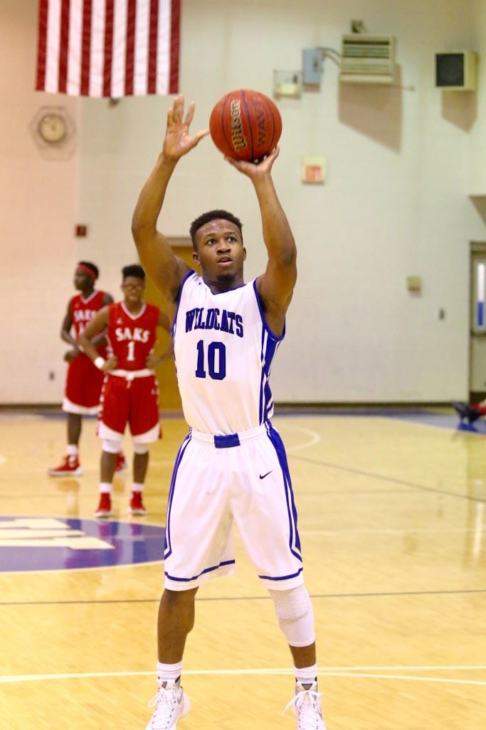 Kevin Carr's twisting layup that beat the halftime horn capped a furious run that took White Plains from two up to seven at the break. (Photo by Kristen Stringer/Krisp Pics Photography)