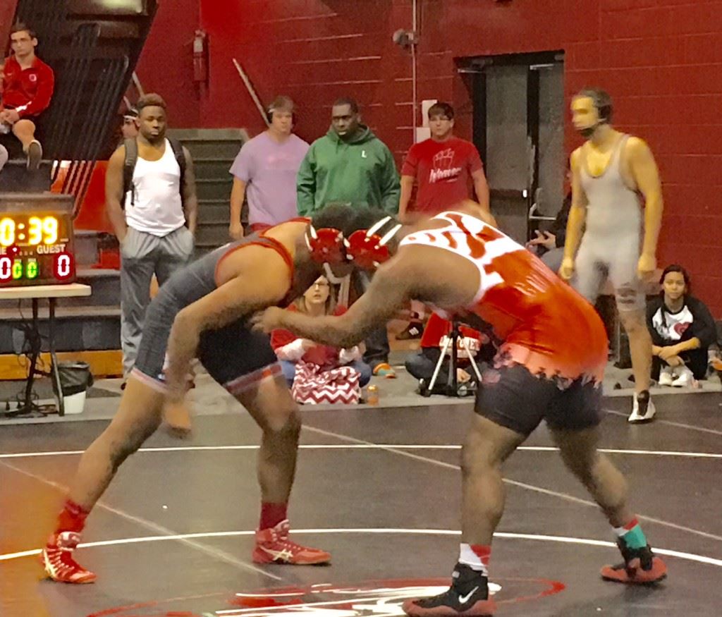 Ohatchee's Caleb Montgomery (L) and Bob Jones' Dominic Davis look for an early advantage in the 222 title match, the only championship match pitting former and current wrestlers of Bob Jones coach Matt Sweatman.