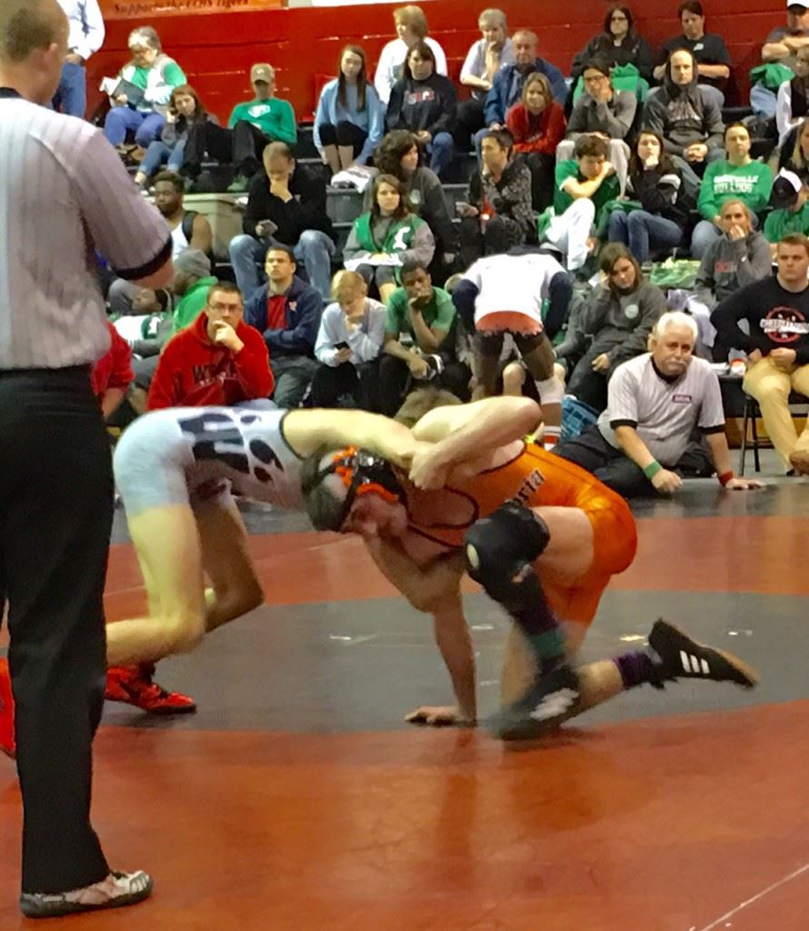 Weaver's Nick Souder (L) looks for leverage against Alexandria's Lane Trapp in the only title match Saturday between two Calhoun County wrestlers. Souder won a 7-2 decision 