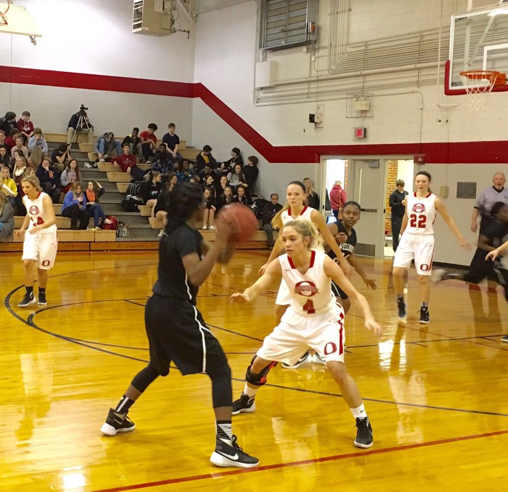 Ohatchee's Hannah Howell (4) tries to tighten up her defense against Wellborn's Vanessa Carter.