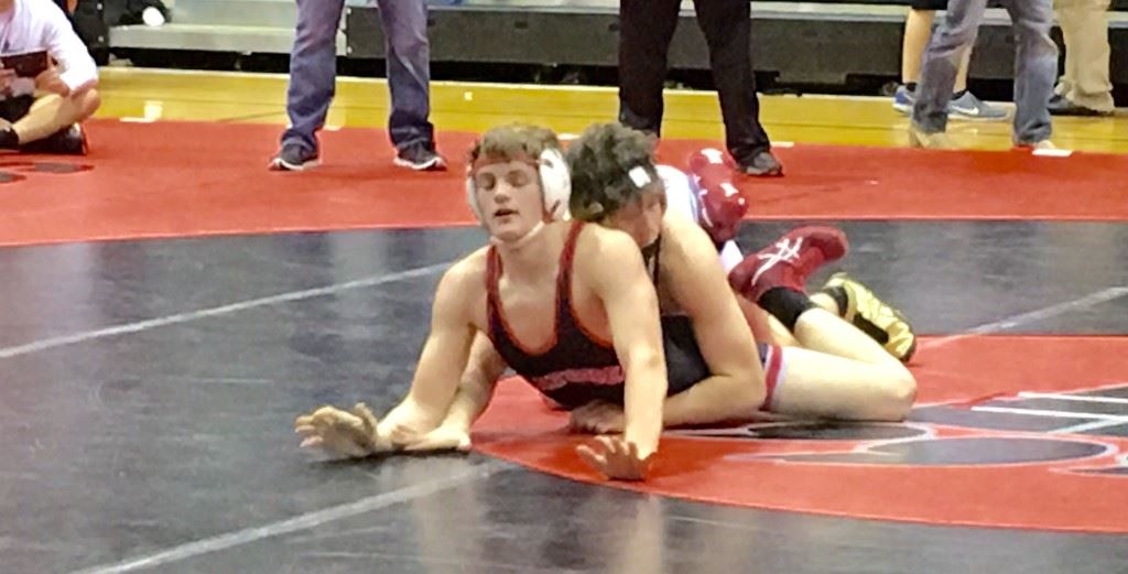 Oxford's Matt King (top) looks to finish off Ohatchee's Hayden Pitts during their 162 final Tuesday. King was voted top wrestler of the tournament.