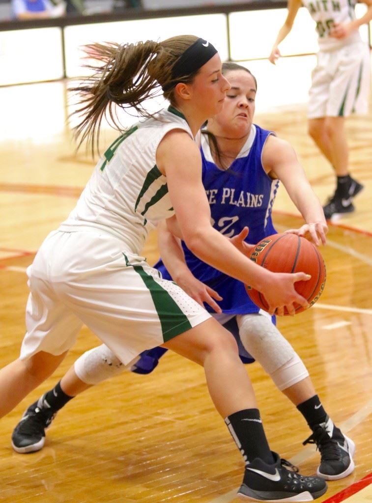 White Plains' Shelby Wood (22) moves in to steal the ball from Faith Christian's Madison Stephens during their Calhoun County Tournament game Saturday. (Photos by Kristen Stringer/Krisp Pics Photography)