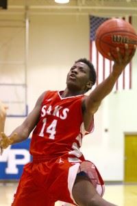 Junior Alfonza Ward lays it up left-handed, but his jump shot keeps everyone guessing as to his dominant hand.